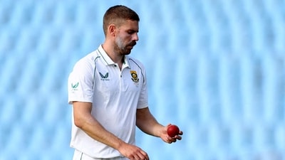 FILE PHOTO: South Africa's Anrich Nortje looks at the ball before bowling in the first cricket test match vs West Indies, March 1, 2023.  REUTERS/Siphiwe Sibeko/File Photo (REUTERS)