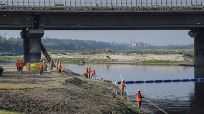 Cleaning operations underway along the banks of the Yamuna river in New Delhi on Monday. (PTI) Cleaning operations underway along the banks of the Yamuna river in New Delhi on Monday. (PTI)