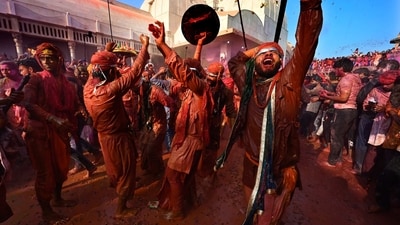Men from Barsana village smeared with colours play Holi. (AP) Men from Barsana village smeared with colours play Holi. (AP)