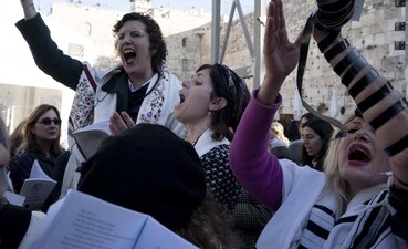 Members of Women of the Wall sing during Rosh Hodesh prayers in the Old City of Jerusalem. The group has waged a decades-long campaign for gender equality at the holy site. (AP) Members of Women of the Wall sing during Rosh Hodesh prayers in the Old City of Jerusalem. The group has waged a decades-long campaign for gender equality at the holy site. (AP)