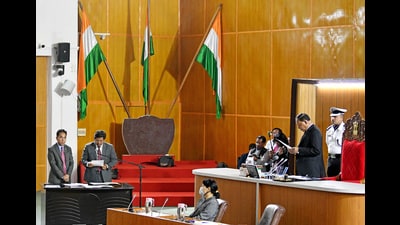 Meghalaya Assembly Pro-tem Speaker Timothy D Shira administers the oath of office to NPP chief Conrad Sangma as the MLA of the State Assembly during the swearing-in ceremony, in Shillong on Monday. (ANI) Meghalaya Assembly Pro-tem Speaker Timothy D Shira administers the oath of office to NPP chief Conrad Sangma as the MLA of the State Assembly during the swearing-in ceremony, in Shillong on Monday. (ANI)