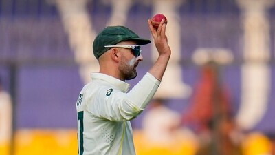 Australian bowler Nathan Lyon shows the ball after scalping 8 wickets during the 2nd day of the 3rd Test (PTI) Australian bowler Nathan Lyon shows the ball after scalping 8 wickets during the 2nd day of the 3rd Test (PTI)