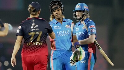 Mumbai Indians' batters Hayley Matthews and Nat Sciver-Brunt with Royal Challengers Bangalore's Sophie Devine at the end of the Women's Premier League (WPL) cricket match between Mumbai Indians and Royal Challengers Bangalore, at the Brabourne Stadium in Mumbai. (PTI) Mumbai Indians' batters Hayley Matthews and Nat Sciver-Brunt with Royal Challengers Bangalore's Sophie Devine at the end of the Women's Premier League (WPL) cricket match between Mumbai Indians and Royal Challengers Bangalore, at the Brabourne Stadium in Mumbai. (PTI)