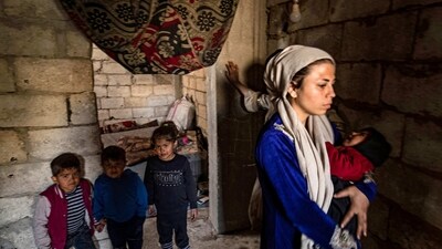 Displaced Syrians living in war-damaged buildings, are pictured in Syria's rebel-held northern city of Raqa on March 1, amid fears that the already fragile dwellings will not withstand an earthquake. (AFP)