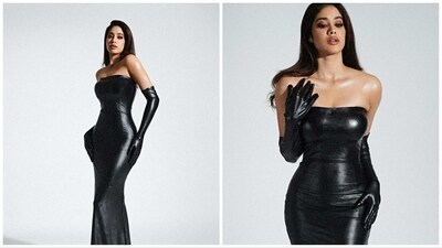 Janhvi Kapoor attended an awards ceremony in a black body-hugging latex gown. She shared pictures of herself in which she paired it with matching gloves which she removed during her public appearance. Janhvi Kapoor attended an awards ceremony in a black body-hugging latex gown. She shared pictures of herself in which she paired it with matching gloves which she removed during her public appearance. 