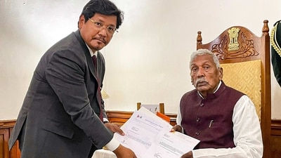 Meghalaya Governor Phagu Chauhan receives the letter of support from National People's Party (NPP) leader Conrad Sangma to form the government in Meghalaya on Monday, (PTI) Meghalaya Governor Phagu Chauhan receives the letter of support from National People's Party (NPP) leader Conrad Sangma to form the government in Meghalaya on Monday, (PTI)