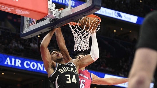 Milwaukee Bucks forward Giannis Antetokounmpo (34) dunks past Washington Wizards forward Anthony Gill (16). (AP)