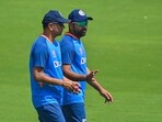India's team captain Rohit Sharma (R) speaks with coach Rahul Dravid during a training session at the Narendra Modi stadium in Ahmedabad on March 7, 2023, ahead of their fourth and final Test cricket match against Australia. (Photo by Punit PARANJPE / AFP) / ----IMAGE RESTRICTED TO EDITORIAL USE - STRICTLY NO COMMERCIAL USE----- India's team captain Rohit Sharma (R) speaks with coach Rahul Dravid during a training session at the Narendra Modi stadium in Ahmedabad on March 7, 2023, ahead of their fourth and final Test cricket match against Australia. (Photo by Punit PARANJPE / AFP) / ----IMAGE RESTRICTED TO EDITORIAL USE - STRICTLY NO COMMERCIAL USE-----