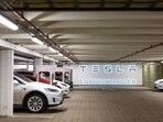 Electric automobiles charge at Tesla Inc. supercharger points at Ullevaal stadium in Oslo, Norway. (Bloomberg)