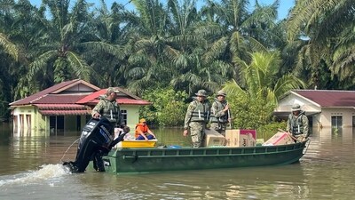 Army personnel on a boat transport aid on a flooded road at Lengga town in Johor state, Malaysia, on March 7. Johor, the country's second-largest state bordering Singapore with four million people, is the worst affected with over 43,000 evacuated to schools and community centers, reports AP. (AP) Army personnel on a boat transport aid on a flooded road at Lengga town in Johor state, Malaysia, on March 7. Johor, the country's second-largest state bordering Singapore with four million people, is the worst affected with over 43,000 evacuated to schools and community centers, reports AP. (AP)