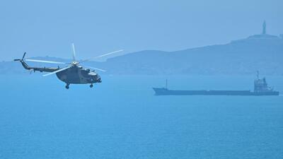 A Chinese military helicopter flying past Pingtan island, one of mainland China's closest point from Taiwan, in Fujian province on August 4, 2022, ahead of massive military drills off Taiwan following then US House Speaker Nancy Pelosi's visit to the self-ruled island. (AFP) A Chinese military helicopter flying past Pingtan island, one of mainland China's closest point from Taiwan, in Fujian province on August 4, 2022, ahead of massive military drills off Taiwan following then US House Speaker Nancy Pelosi's visit to the self-ruled island. (AFP)