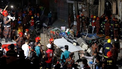 Dhaka Blast: Firefighters and rescue workers are seen on the site of an explosion in a multi storey building in Dhaka, Bangladesh. (Reuters)