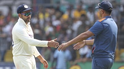 India's captain Rohit Sharma, left, prepares to shake hands with India's head coach Rahul Dravid (AP) India's captain Rohit Sharma, left, prepares to shake hands with India's head coach Rahul Dravid (AP)