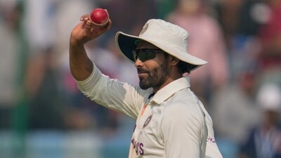 India's Ravindra Jadeja displays the ball after taking seven wickets as he walks back pavilion at the end of Australian second inning (AP) India's Ravindra Jadeja displays the ball after taking seven wickets as he walks back pavilion at the end of Australian second inning (AP)