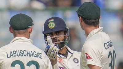 India's Virat Kohli, second right, talks to Australian players as they wait for the third umpire's decision (AP)