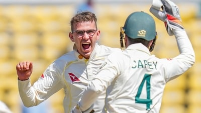 Australia's Todd Murphy, left, along with his teammate Alex Carey celebrate dismissal of India's Virat Kohli (AP) Australia's Todd Murphy, left, along with his teammate Alex Carey celebrate dismissal of India's Virat Kohli (AP)
