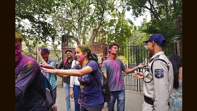 Ramjas College students who played Holi on campus, were not allowed to re-enter the college premises by the security guards. (Photos: Gokul VS/HT)