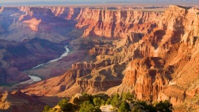Grand Canyon National Park: Grand Canyon National Park is one of the most iconic national parks in the US. The park is home to a variety of landscapes, including its iconic canyon walls, desert landscapes, and lush forests. Visitors can also explore the park's unique wildlife, including bighorn sheep, mule deer, and mountain lions.&nbsp; (Unsplash)