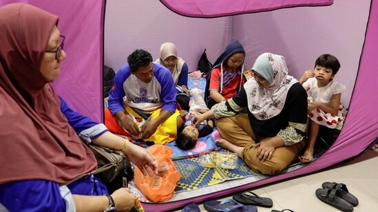 Flood victims rest inside a tent at an evacuation centre after their house was submerged in floodwaters at Kota Tinggi, Johor. Authorities have set up more than 200 relief shelters for people displaced by the floods, the national disaster management agency said, reported Reuters.&nbsp;(Hasnoor Hussain / Reuters)