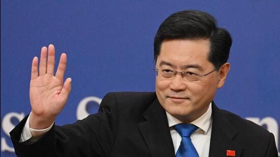 China's foreign minister Qin Gang waves after a press conference at the Media Center of the National People’s Congress in Beijing on Tuesday. (AFP)