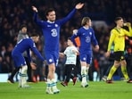 Soccer Football - Champions League - Round of 16 - Second Leg - Chelsea v Borussia Dortmund - Stamford Bridge, London, Britain - March 7, 2023 A pitch invader celebrates with Chelsea's Enzo Fernandez and Conor Gallagher after the match REUTERS/Hannah Mckay