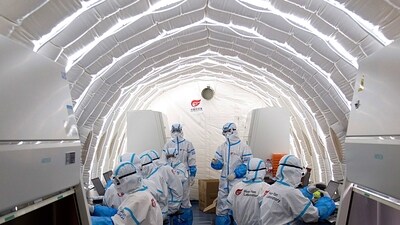 Staff members work in an inflatable COVID-19 testing lab provided by Chinese biotech company BGI Genomics in Beijing, (AP)