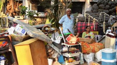 Kalyan, India - March 08, 2023: Residents of Shanti Upvan building collect their belongings and valuables as KDMC allows them on the fifth day after one of its five wings in the Lodha Heaven Complex developed visible cracks and parts of the base began caving in and they had to vacate the building, at Nilje, in Dombivli, India, on Wednesday, March 08, 2023. (Photo by Pramod Tambe/HT Photo) (HT PHOTO) Kalyan, India - March 08, 2023: Residents of Shanti Upvan building collect their belongings and valuables as KDMC allows them on the fifth day after one of its five wings in the Lodha Heaven Complex developed visible cracks and parts of the base began caving in and they had to vacate the building, at Nilje, in Dombivli, India, on Wednesday, March 08, 2023. (Photo by Pramod Tambe/HT Photo) (HT PHOTO)