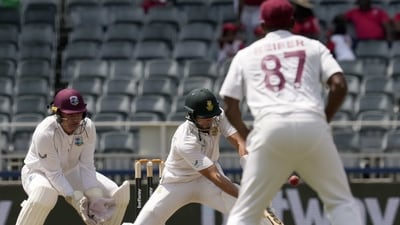 South Africa's batsman Aiden Markram, right, plays a reverse shot as West Indies's wicketkeeper Joshua Da Silva watches on during the first day (AP) South Africa's batsman Aiden Markram, right, plays a reverse shot as West Indies's wicketkeeper Joshua Da Silva watches on during the first day (AP)