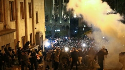 Georgia Protests: Protesters clash with riot police near the Georgian parliament in Tbilisi. (AFP)