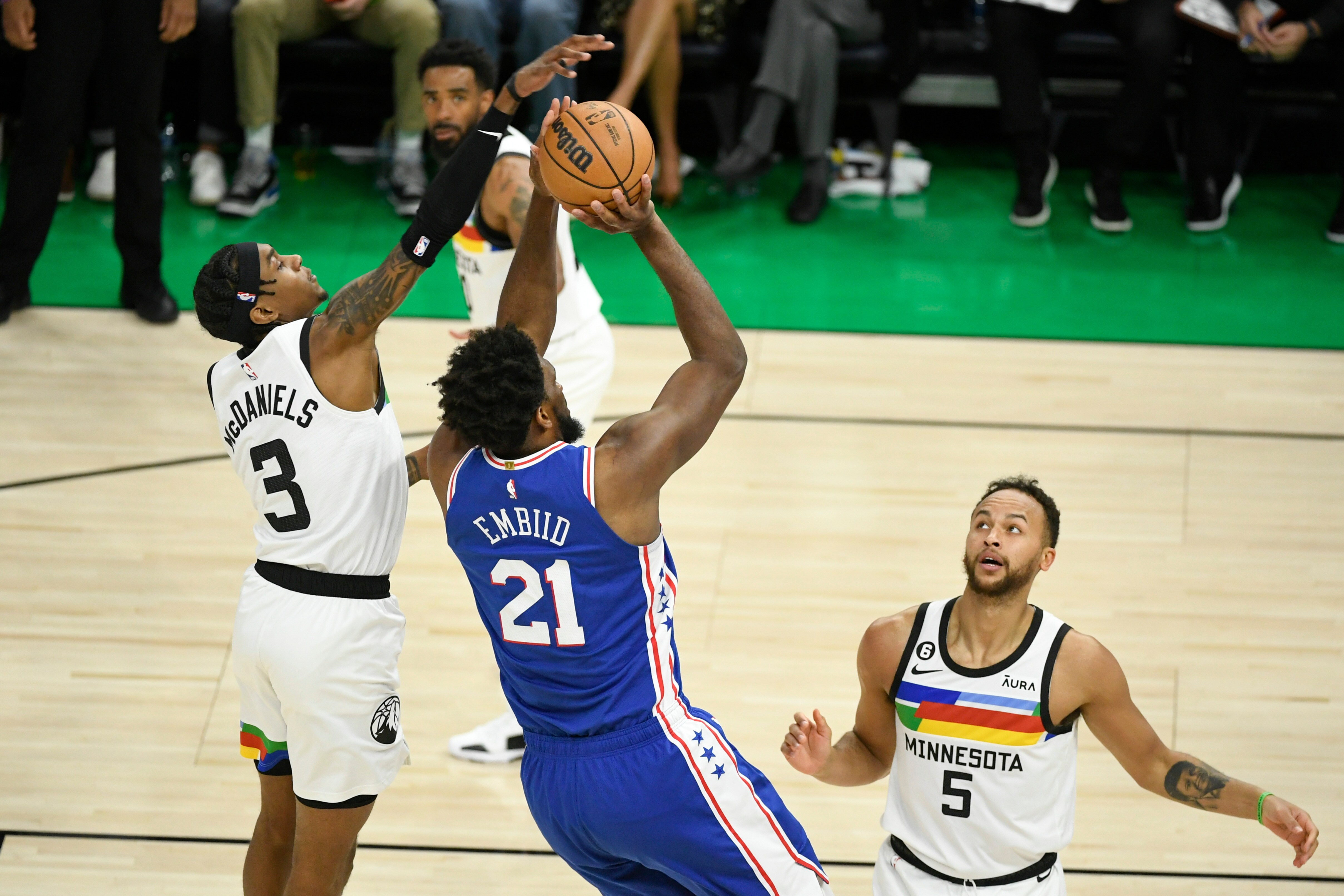 Minnesota Timberwolves forward Jaden McDaniels (3) fouls Philadelphia 76ers center Joel Embiid (21) as Timberwolves forward Kyle Anderson (5) looks on during the second half of an NBA basketball game Tuesday, (AP) Minnesota Timberwolves forward Jaden McDaniels (3) fouls Philadelphia 76ers center Joel Embiid (21) as Timberwolves forward Kyle Anderson (5) looks on during the second half of an NBA basketball game Tuesday, (AP)