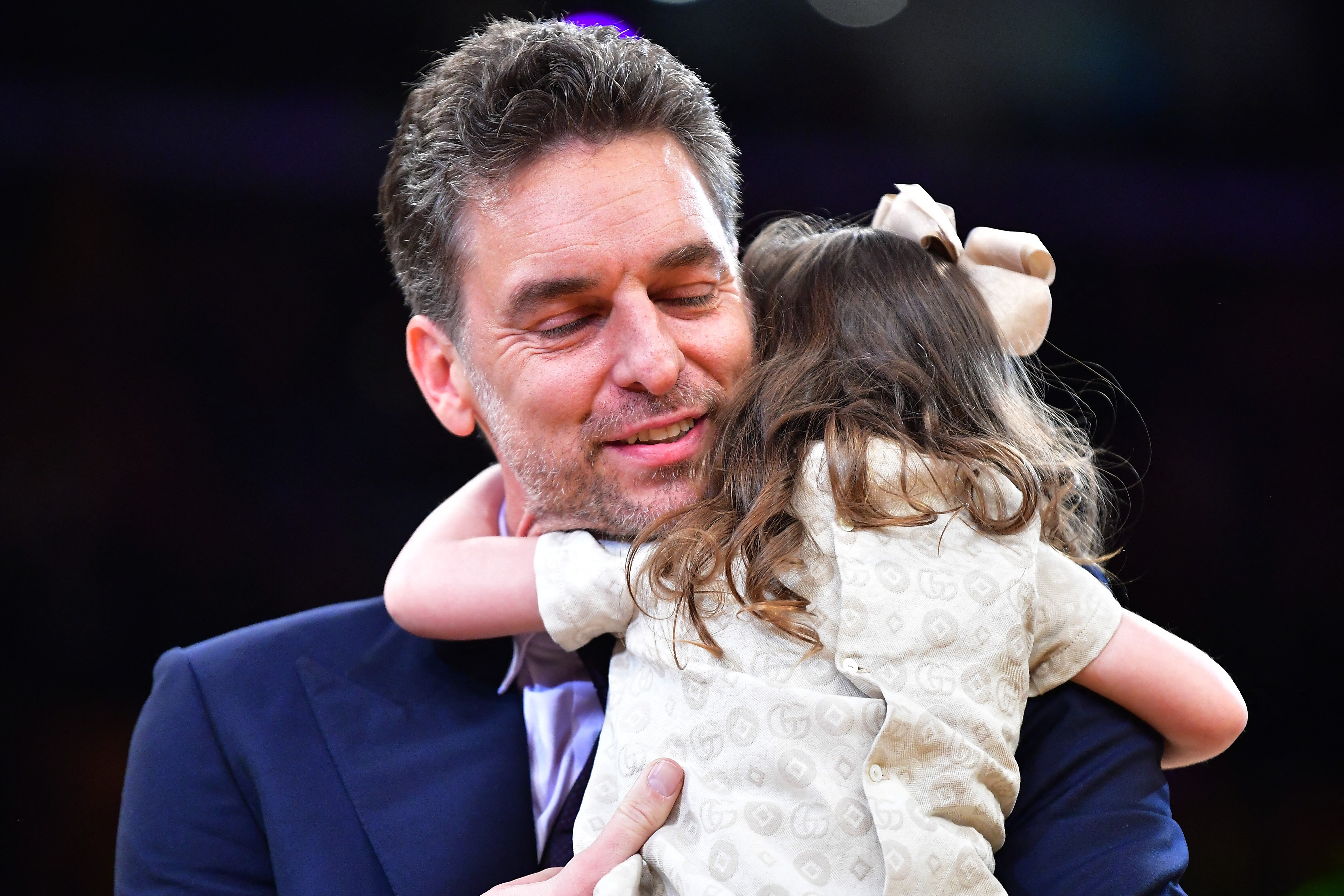 Los Angeles Lakers former player Pau Gasol hugs his daughter Elisabet Gianna during his jersey retirement at Crypto.com Arena. (USA TODAY Sports)