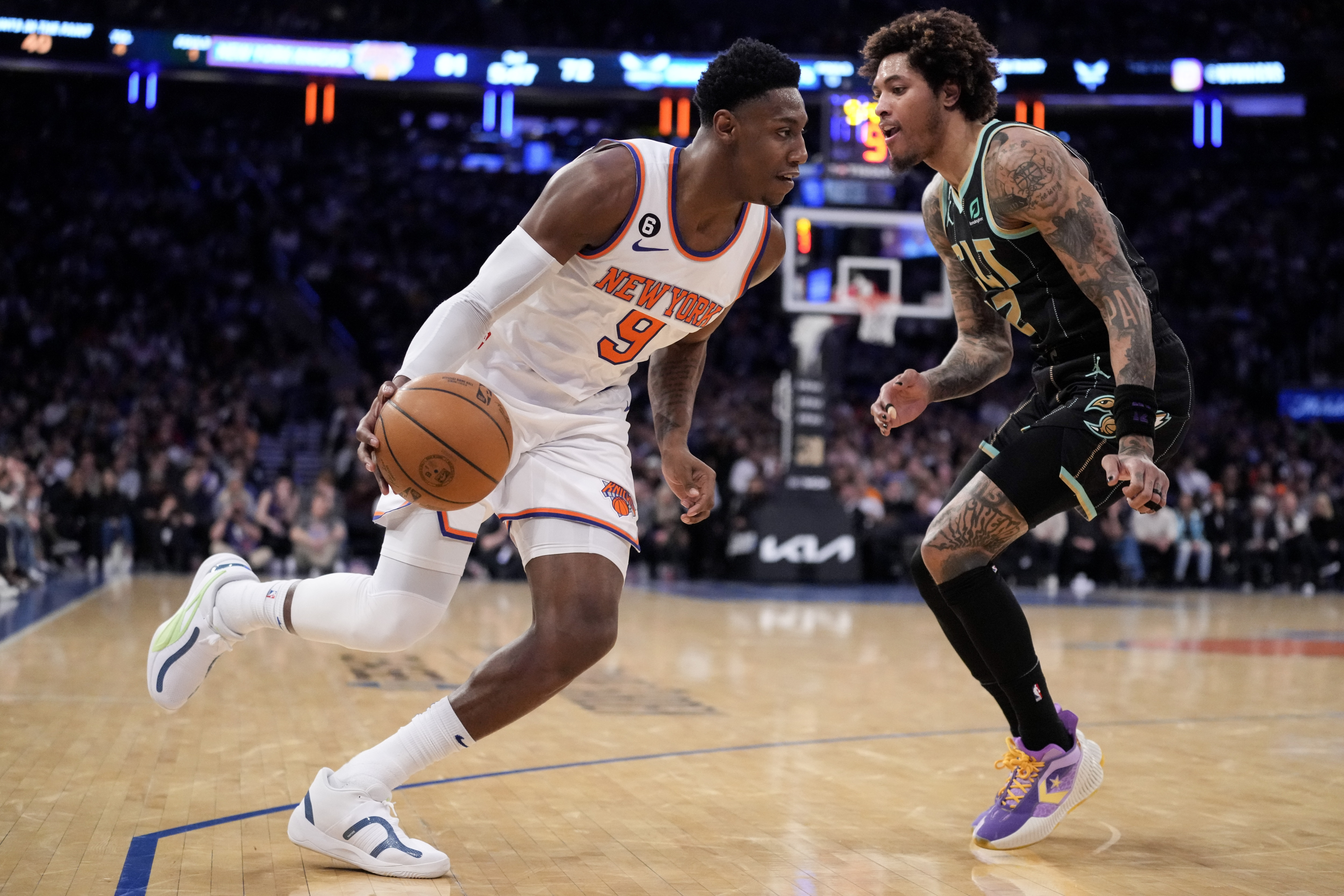 New York Knicks guard RJ Barrett (9) drives against Charlotte Hornets guard Kelly Oubre Jr. (12) during the second half of an NBA basketball game, Tuesday, (AP) New York Knicks guard RJ Barrett (9) drives against Charlotte Hornets guard Kelly Oubre Jr. (12) during the second half of an NBA basketball game, Tuesday, (AP)
