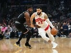 Toronto Raptors' Fred VanVleet (23) drives past Los Angeles Clippers' Terance Mann (14) during first half of an NBA basketball game Wednesday. Toronto Raptors' Fred VanVleet (23) drives past Los Angeles Clippers' Terance Mann (14) during first half of an NBA basketball game Wednesday.