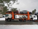A trailer loaded with vehicles to send to Ukraine, which were confiscated from drunk drivers, in Riga, Latvia.