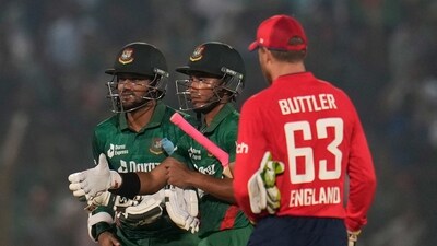 England's captain Jos Buttler, right, walks to greet Bangladesh's captain Shakib Al Hasan (AP) England's captain Jos Buttler, right, walks to greet Bangladesh's captain Shakib Al Hasan (AP)