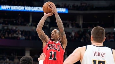 Chicago Bulls forward DeMar DeRozan, back, goes up for a basket over Denver Nuggets guard Jamal Murray, front left, and center Nikola Jokic in the second half of an NBA basketball game Wednesday, (AP) Chicago Bulls forward DeMar DeRozan, back, goes up for a basket over Denver Nuggets guard Jamal Murray, front left, and center Nikola Jokic in the second half of an NBA basketball game Wednesday, (AP)
