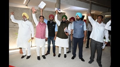Congress MLAs led by the leader of opposition Partap Singh Bajwa walked out of the Punjab assembly on Thursday to protest a remark by state rural development minister Kuldeep Singh Dhaliwal. (Ravi Kumar/HT Photo) Congress MLAs led by the leader of opposition Partap Singh Bajwa walked out of the Punjab assembly on Thursday to protest a remark by state rural development minister Kuldeep Singh Dhaliwal. (Ravi Kumar/HT Photo)