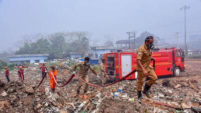 Fire and rescue personnel at the Brahmapuram waste treatment plant, in Kochi. (PTI) Fire and rescue personnel at the Brahmapuram waste treatment plant, in Kochi. (PTI)