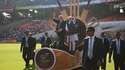 PM Modi and Australia's PM Anthony Albanese wave to spectators from atop a float at the Narendra Modi stadium in Ahmedabad. (AFP) PM Modi and Australia's PM Anthony Albanese wave to spectators from atop a float at the Narendra Modi stadium in Ahmedabad. (AFP)