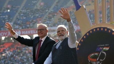 Prime Minister Narendra Modi (R) and Australian counterpart Anthony Albanese (L) wave to spectators from atop a float at the Narendra Modi stadium in Ahmedabad. (AFP) Prime Minister Narendra Modi (R) and Australian counterpart Anthony Albanese (L) wave to spectators from atop a float at the Narendra Modi stadium in Ahmedabad. (AFP)