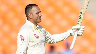 Australia's Usman Khawaja raises his bat to celebrate scoring a century during the first day of the 4th Test (AP) Australia's Usman Khawaja raises his bat to celebrate scoring a century during the first day of the 4th Test (AP)