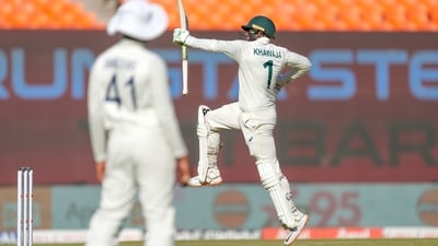 Australia's Usman Khawaja, right, jumps into the air while celebrating his century (AP) Australia's Usman Khawaja, right, jumps into the air while celebrating his century (AP)