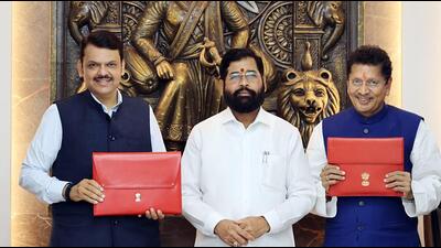 Maharashtra Deputy Chief Minister and Finance Minister Devendra Fadnavis and state Marathi Language Minister Deepak Kesarkar display a suitcase containing papers of the State Budget 2023-24 in the presence of State CM Eknath Shinde to be presented during the Budget Session of the State Assembly, in Mumbai on Thursday. (ANI PHOTO) Maharashtra Deputy Chief Minister and Finance Minister Devendra Fadnavis and state Marathi Language Minister Deepak Kesarkar display a suitcase containing papers of the State Budget 2023-24 in the presence of State CM Eknath Shinde to be presented during the Budget Session of the State Assembly, in Mumbai on Thursday. (ANI PHOTO)