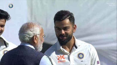 PM Modi shakes hands with Virat Kohli PM Modi shakes hands with Virat Kohli