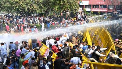 Punjab BJP workers facing water cannons to prevent them from marching to the Vidhan Sabha in Chandigarh on Thursday. (Keshav Singh/HT)