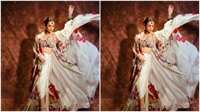 Malaika added more oomph to her look with a statement white satin shrug around her shoulders featuring patterns in shades of red, grey, green and black. In a statement silver neck choker, silver oxidised bangles, bracelet, finger rings and a maang tikka, Malaika added boho vibes to her look. (Instagram/@malaikaaroraofficial) Malaika added more oomph to her look with a statement white satin shrug around her shoulders featuring patterns in shades of red, grey, green and black. In a statement silver neck choker, silver oxidised bangles, bracelet, finger rings and a maang tikka, Malaika added boho vibes to her look. (Instagram/@malaikaaroraofficial)