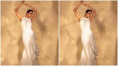 Here’s a picture of Malaika looking like a queen in the sleeveless white gown featuring silver embroidery work, cut-out details at the sides, and frill patterns with pleat details below the waist. (Instagram/@malaikaaroraofficial) Here’s a picture of Malaika looking like a queen in the sleeveless white gown featuring silver embroidery work, cut-out details at the sides, and frill patterns with pleat details below the waist. (Instagram/@malaikaaroraofficial)