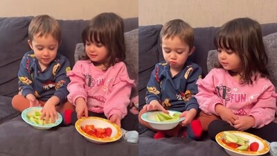 The image, taken from the viral video, shows twins sharing fruits. (Instagram/@mummy_and_themunirtwins) The image, taken from the viral video, shows twins sharing fruits. (Instagram/@mummy_and_themunirtwins)
