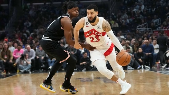 Toronto Raptors' Fred VanVleet (23) drives past Los Angeles Clippers' Terance Mann (14) during first half of an NBA basketball game Wednesday. (AP)
