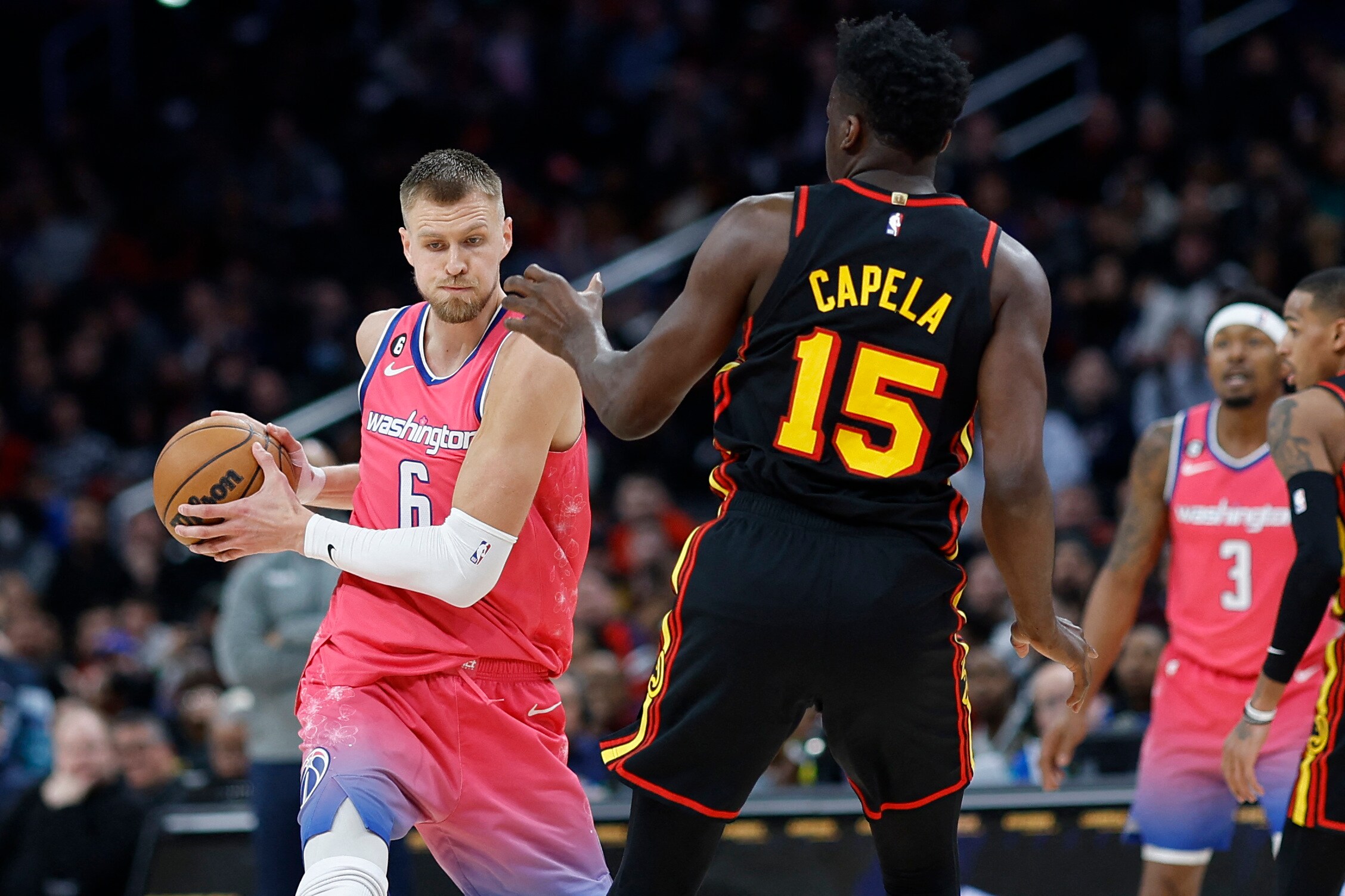 Washington Wizards center Kristaps Porzingis (6) holds the ball as Atlanta Hawks center Clint Capela (15) defends in the fourth quarter at Capital One Arena. (USA TODAY Sports)